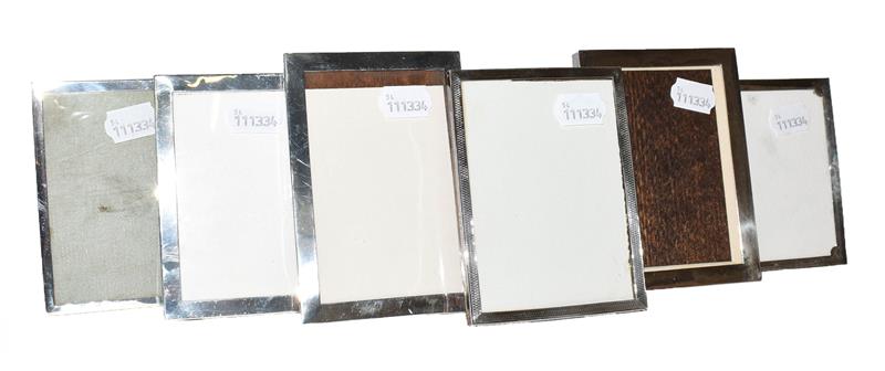 A collection of Six Various Silver-Mounted Photograph-Frames, each oblong, four plain and two with