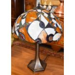 A Tiffany style table lamp, the shade embellished with cabouchons, 59cm . (in good condition)