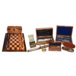A 19th century carved and turned wooden chess set in case, a rosewood, mahogany and walnut parquetry