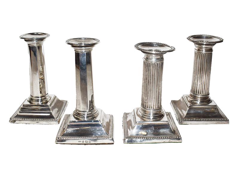 Two Pairs of Edward VII Silver Candlesticks, the first pair by Israel Sigmund Greenberg, Birmingham,