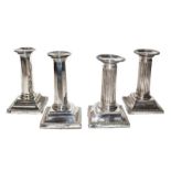 Two Pairs of Edward VII Silver Candlesticks, the first pair by Israel Sigmund Greenberg, Birmingham,