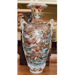 A very large Japanese Meiji period satsuma flower vase with twin shi shi dog handles and decorated