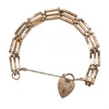 A gate link bracelet, stamped '9' and '.375', with a 9 carat gold heart shaped padlock clasp, length