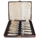 A set of silver bladed and mother of pearl handled fish knives and forks by William Hutton & Sons