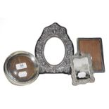 Four Various Silver Photograph-Frames, two stamped with decoration and two plain, 23cm high and