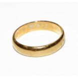 A 22 carat gold band ring, finger size P. Gross weight 5.4 grams.