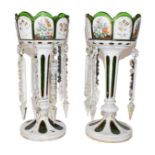 A pair of Bohemian green glass table lustres, 29cm highFour lustre drops missing. Wear to all of the