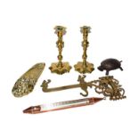 A pair of 18th century brass candlesticks on petal bases, a copper jam thermometer, brass desk stand