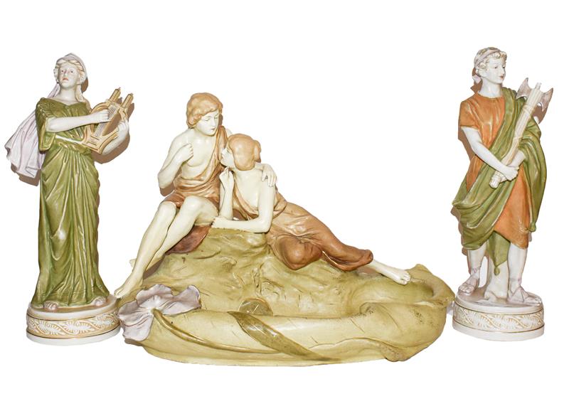 Two Royal Dux figures, together with a continental figural dish (3) These pieces are post 1919 and