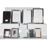 A collection of Nine Various Silver-Mounted Photograph-Frames, each oblong, mostly plain, though two