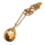 A citrine and split pearl pendant on chain, pendant length 3.5cm, chain length 38cm . Chain with