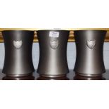 A set of three pewter Dom Perignon Champagne ice buckets (3)