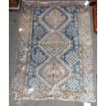 Gendje rug, the indigo stepped lattice field enclosed by leaf and calyx borders, 137cm by 115cm,