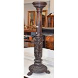 An early 20th century carved mahogany plant pedestal