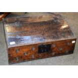 A 17th century oak bible box, together with a similar carved oak panel depicting musical putti,