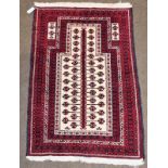 Baluch prayer rug, the cream field with 'Tree of Life' enclosed by multiple borders, 136cm by 96cm