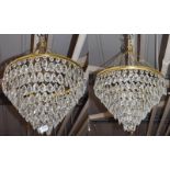 A pair of seven-tier chandeliers with cut glass droplets, 30cm drop by 45cm diameter (approximately)