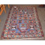Karabagh rug, the steel blue diamond lattice field beneath the Mihrab enclosed by ivory borders,