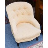 A buttoned tub chair with a mahogany frame