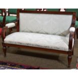 A 19th century carved mahogany two-seater hall bench, with foliate carved scrolling arms and