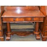 A Victorian mahogany washstand incorporating two drawers, raised on tapering column supports and
