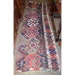 Anatolian Kilim fragment, the indigo field with a column of latchhook medallions enclosed on three