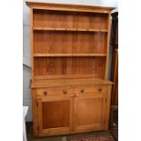 A Victorian pine kitchen dresser, the shelved rack above two drawers with two cupboards below, 138cm