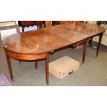 A George III mahogany D end dining table with three leaves, 265cm by 107cm by 72cm