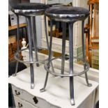 A set of four chromed bar stools
