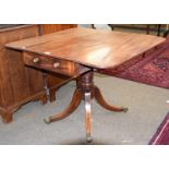 A 19th century mahogany pedestal table with drop leaves, fitted with a drawer opposed by a dummy,