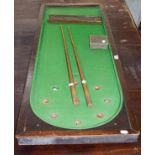 A late 19th century table top bar Billiards table with cues, balls and scoreboard