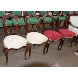 A set of four Victorian walnut dining chairs with carved balloon backs (4)