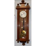 A walnut veneered Vienna type striking wall clock, circa 1890, the double weight driven movement