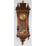 A walnut veneered Vienna type striking wall clock, circa. 1890, the double spring barrel movement