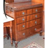 A George V mahogany dressing table ornamented in blind fret carving, 113cm by 56cm by 170cm,