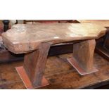 A rustic elm bench with an adzed top and exposed tenons, 104cm by 34cm by 42cm, together with a