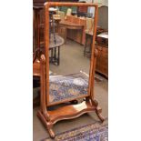 A Victorian mahogany cheval mirror moving on castors, 82cm by 63cm by 163cm