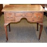 A George III provincial oak lowboy, 91cm by 57cm by 77cm