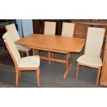 An Ercol light elm extending dining table, 150cm by 92cm closed, together with a set of six matching