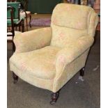 A Victorian upholstered armchair on oak frame