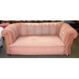 A Victorian drop arm Chesterfield style sofa with mahogany frame (in need of re-upholstery), 172cm