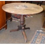 An 18th century oak plank top centre pedestal table, 93cm by 73cm, together with a South East