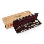 Piccolo Yamaha YPC-32 no.82113, resin body with metal head stamped 'Yamaha Made in Japan', in