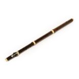 Rosewood Flute six holes and one key, in four sections with ivory crown and joint rings, length