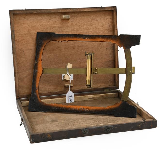 Clinometer showing inclination in inches per foot on brass scale, with level on arm in rectangular