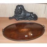 A cast-iron flat back model of a recumbent lion, 70cm; together with a large Edwardian oval mahogany