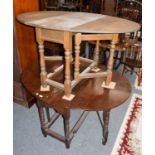 Two oak gateleg dining tables (2)