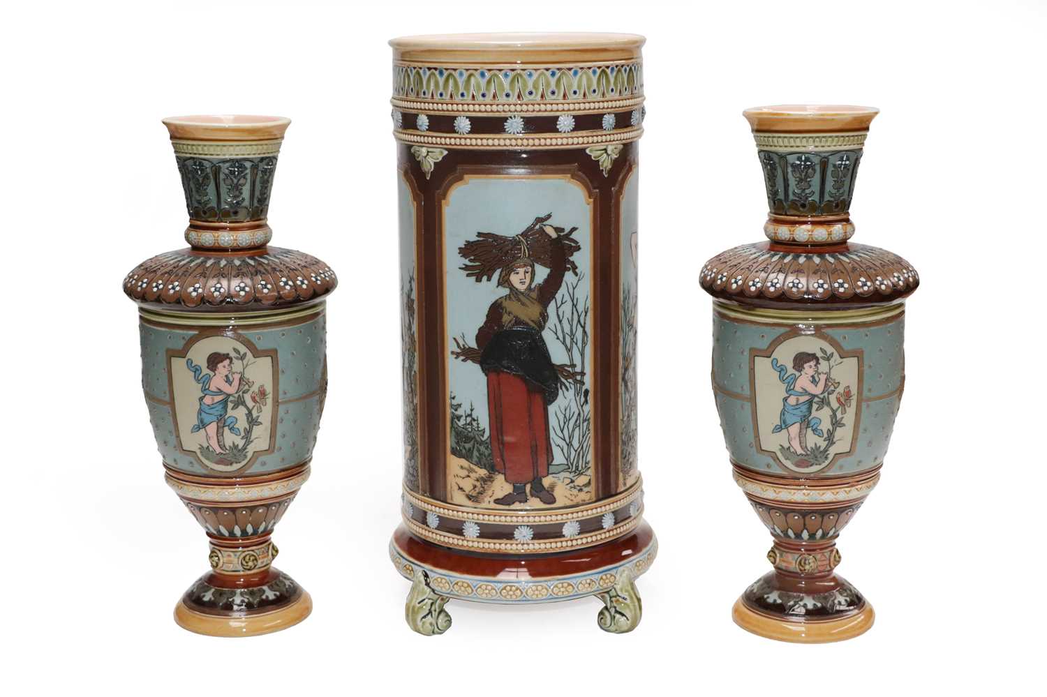 A Mettlach cylindrical vase with sprigged borders and incised panels of rural figures, 33.5cm;