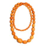 An amber type bead necklace, length 83cm (approximately)Condition report: Gross weight 78.8 grams.