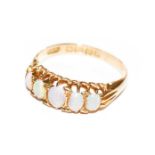 An 18 carat gold opal five stone ring, finger size K1/2